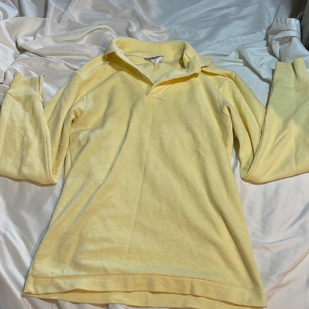 yellow collared shirt